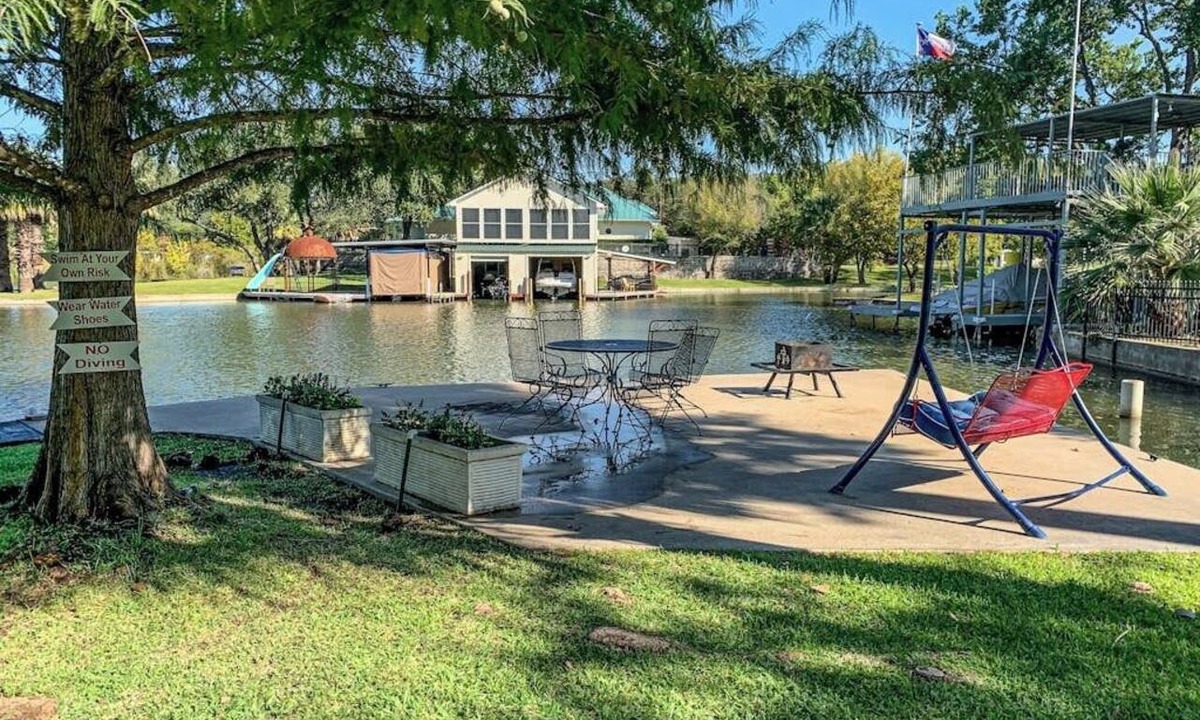 Kingsland House | Charming dog-friendly lakefront home with lake view, dock, & washer/dryer