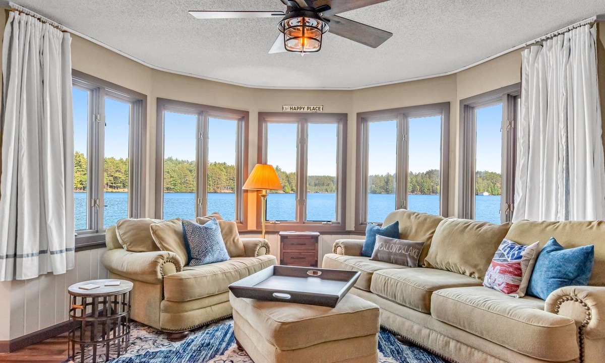Three Lakes Cabin | Charming lakefront cabin with fireplace, on-site hot tub, firepit & games