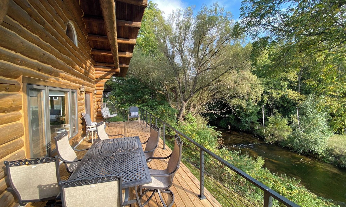 Pentwater Cabin | Cozy cabin on the Pentwater River with hot tub, central air and ample parking.