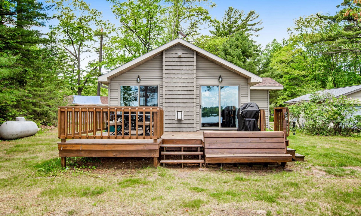 Tomahawk House | Dog-friendly lakefront home with high-speed WiFi, dock, private w/d, & firepit