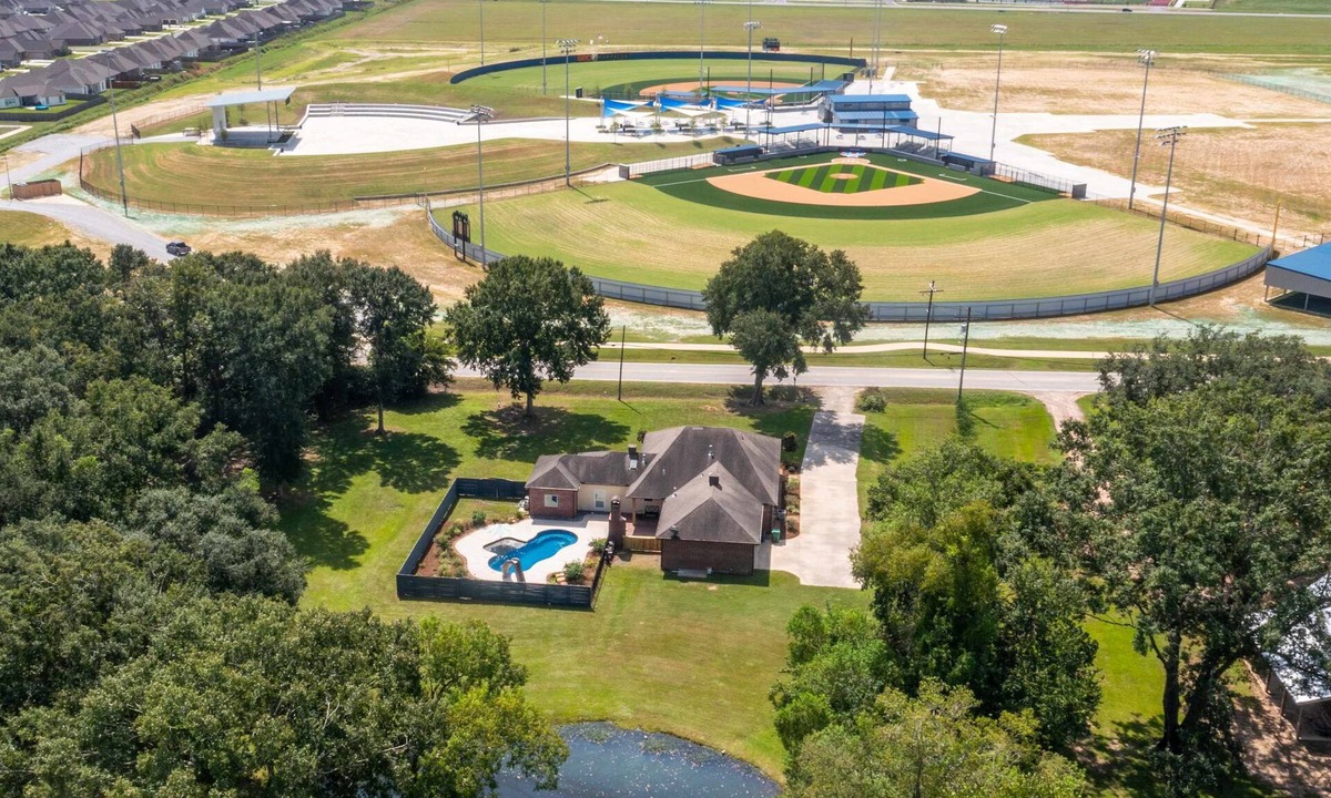 Youngsville House | Gameday Getaway Pool Pond King Bed Sports Complex Office