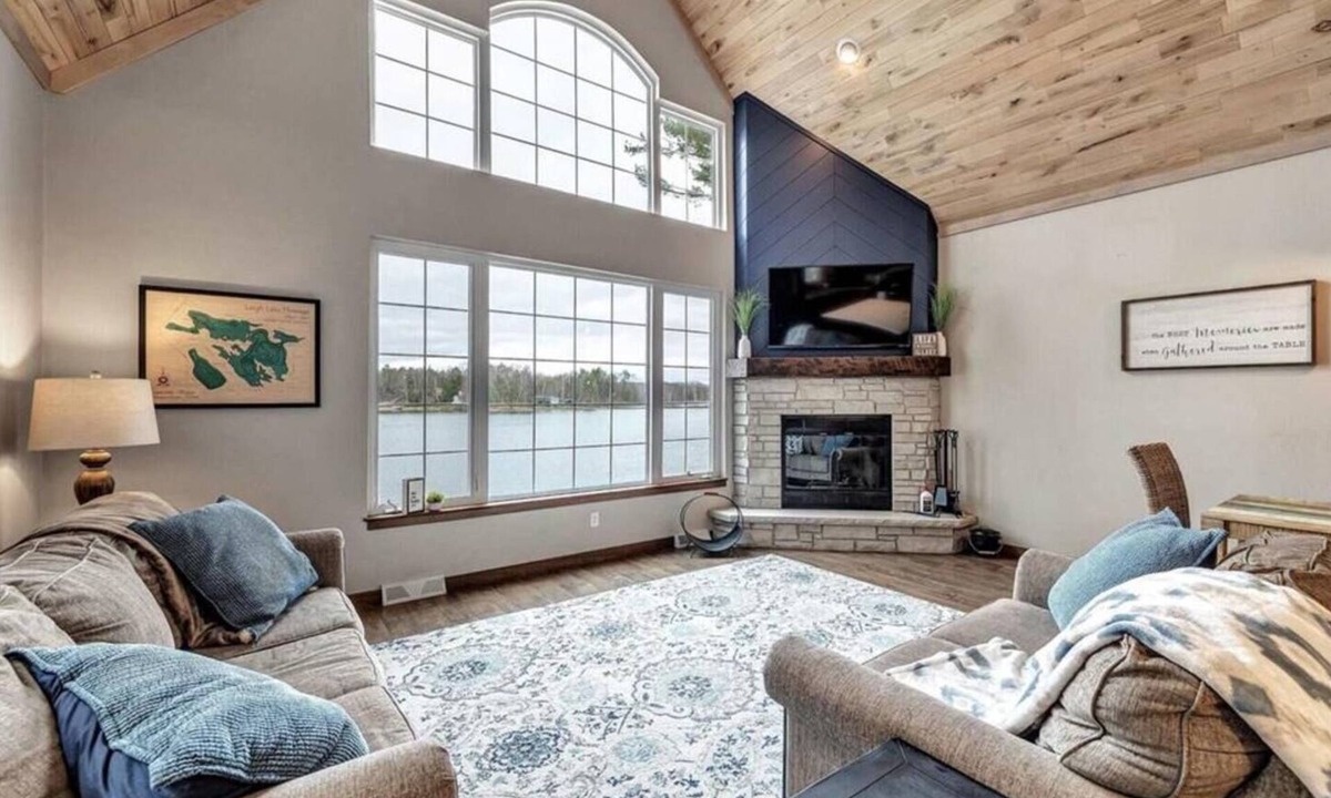 Krakow House | Highlights: Private beach just steps from your door Includes kayaks for exploring the lake Great fishing right off the shoreline or dock Bring your boat and enjoy full boating access Cozy indoor fireplace for cool evenings 4 spaciou
