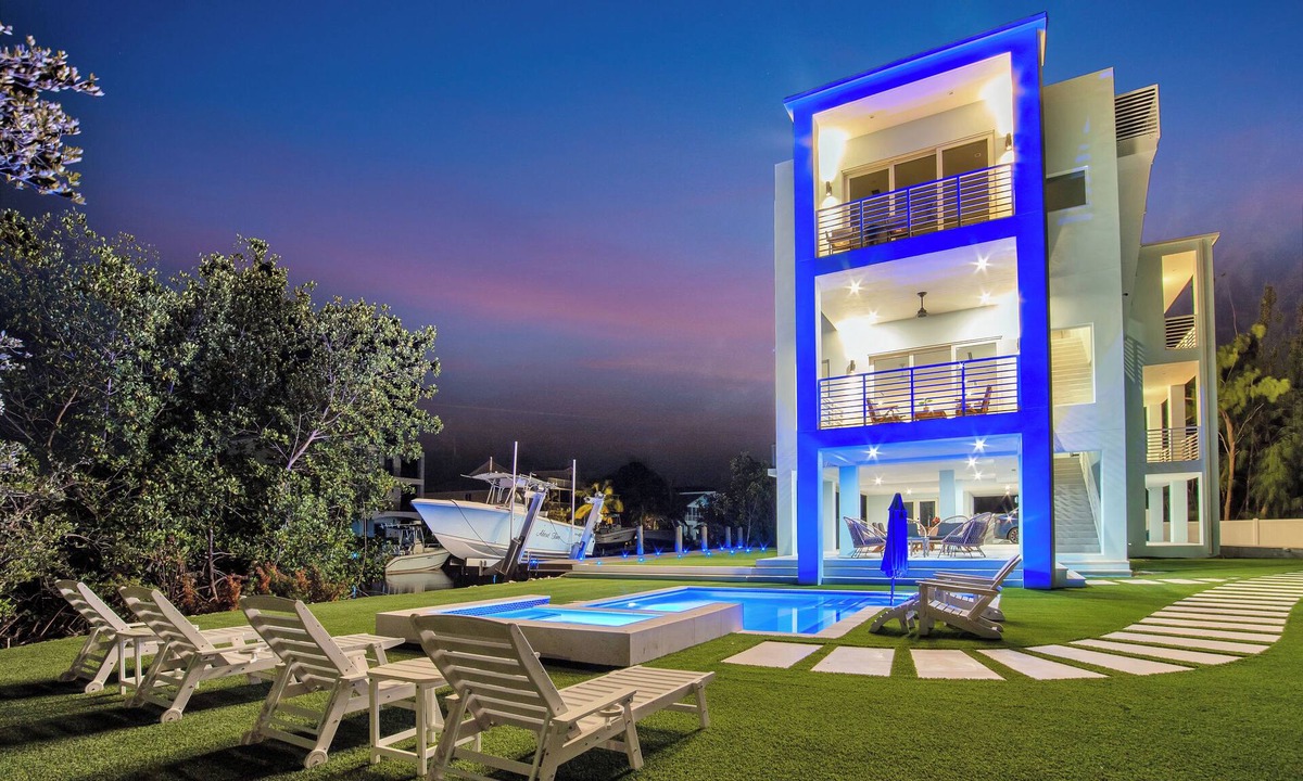 Pirates Cove House | Keys Casa: Elegant Waterfront Retreat, Sleeps 16, Elevator, Private Dock, Putt-Putt
