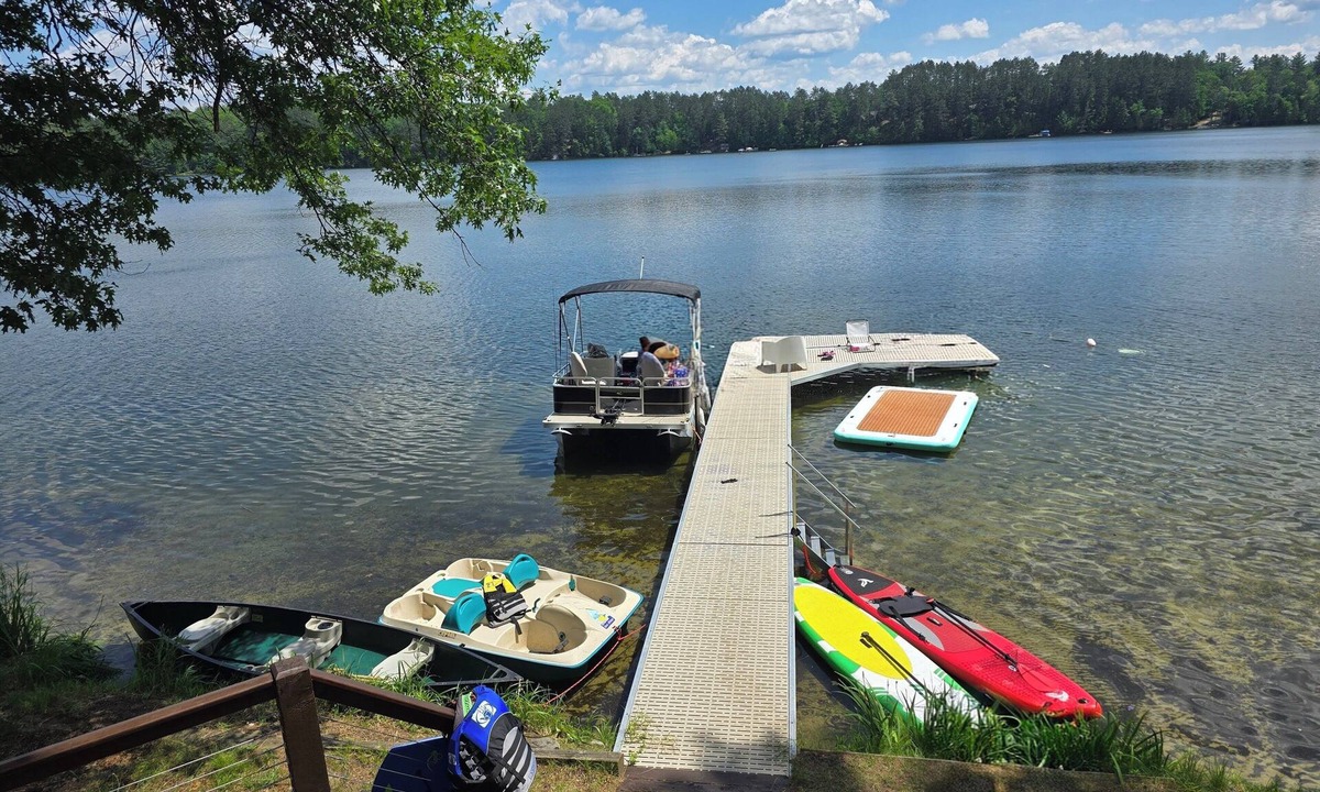 Eagle River Cabin | Lakefront Retreat with Sandy Beach, Swim Area & Relaxing Lakeside Seating!