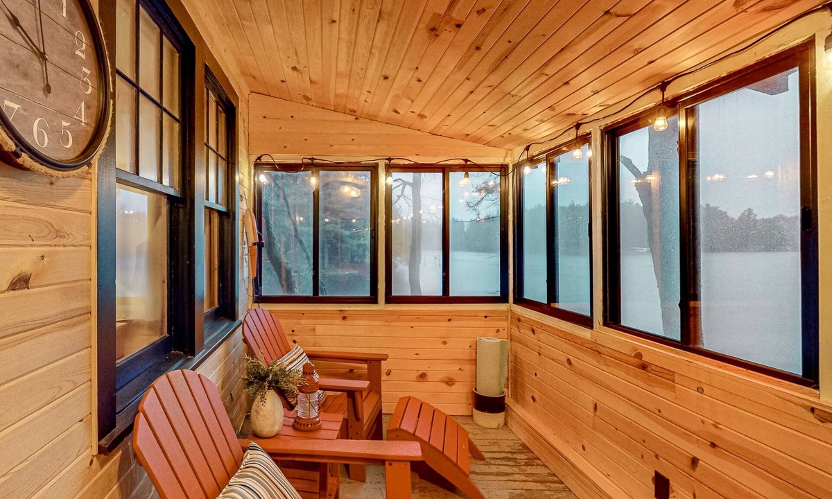 Three Lakes Cabin | Lakeside cabin with a firepit, sunroom, & seasonal dock