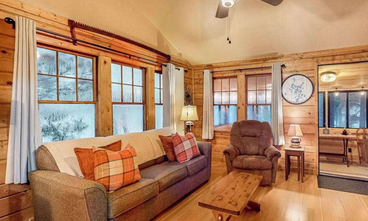 Three Lakes House | Lakeside cabin with a firepit, sunroom, & seasonal dock