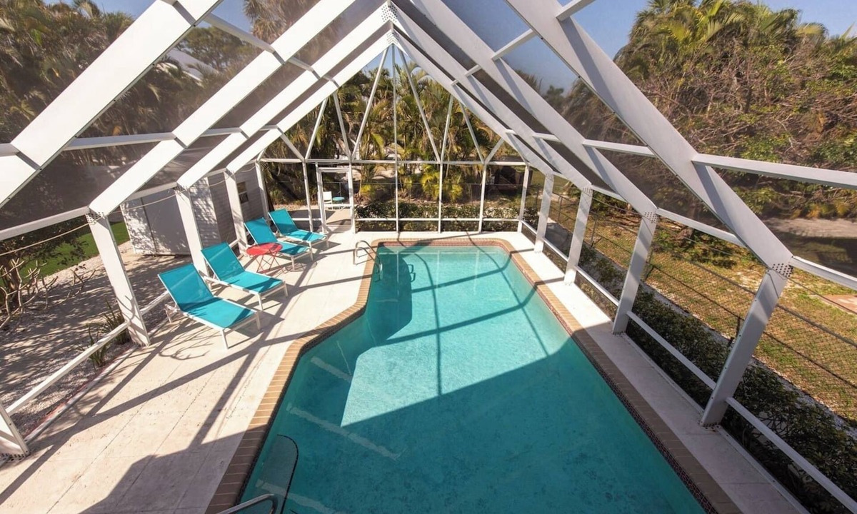 East Naples House | Naples Beach Escape | Pool, Canal Views & Tiki Vibes Near Pier & 5th Avenue