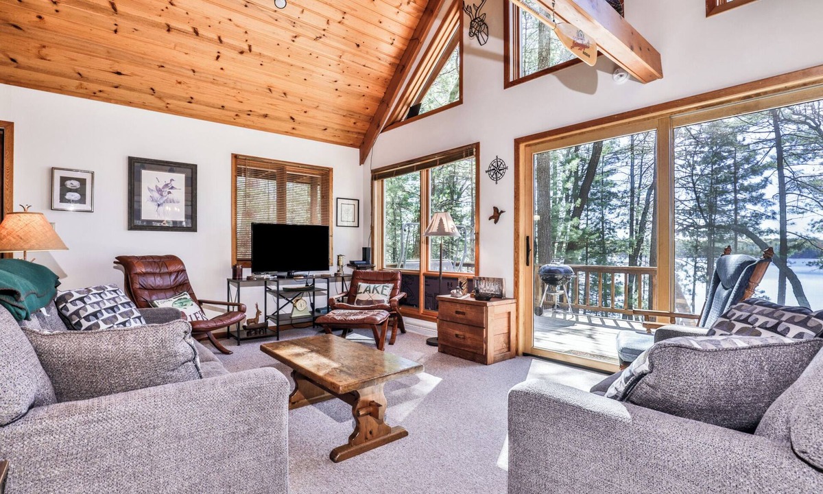 Three Lakes House | Private lakeside cabin on the shore of Virgin Lake with a large deck and firepit