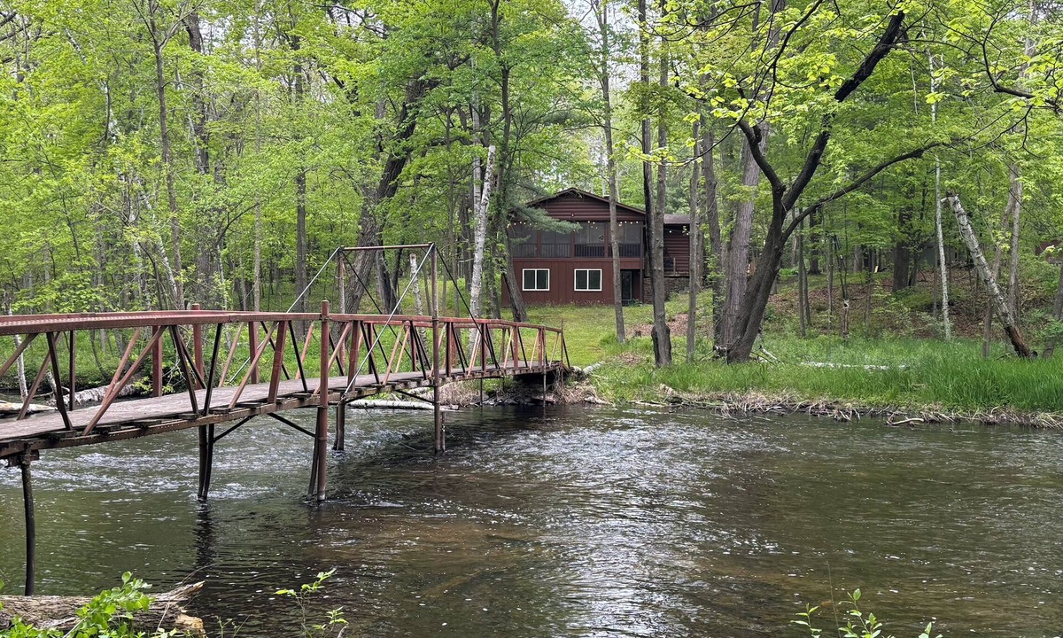 Amery Cabin | Private riverfront cabin with wooded hiking trails