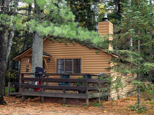Babbitt House | Secluded Rustic-Modern Cabin with Rock Fireplace & Pine-Surrounded Deck Near Babbitt, Minnesota