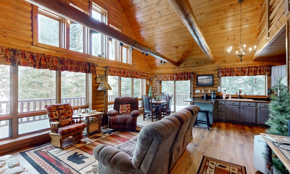 Presque Isle Cabin | Spacious and beautiful lakefront log home on 7 acres with private dock
