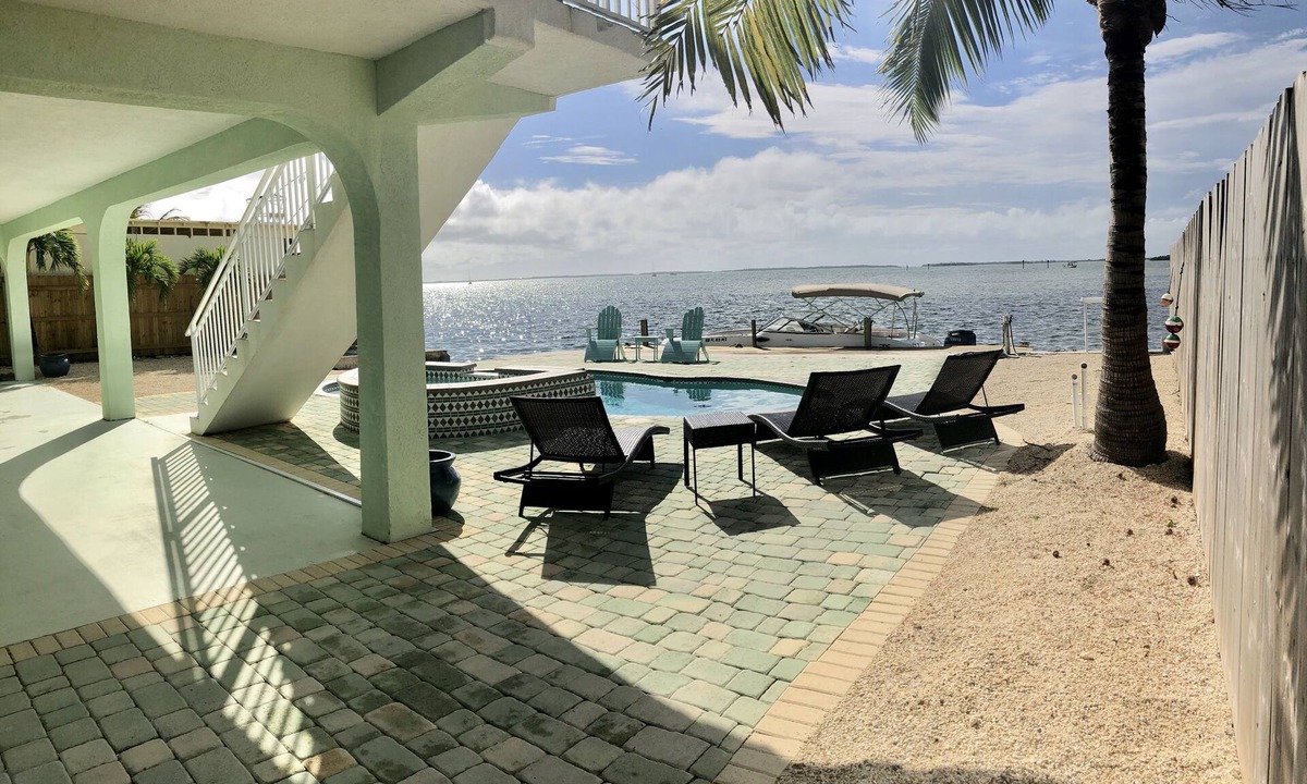 Breezeswept Beach Estates House | Water Front Home. Direct deep water access with private pool/spa/dock & Elevator