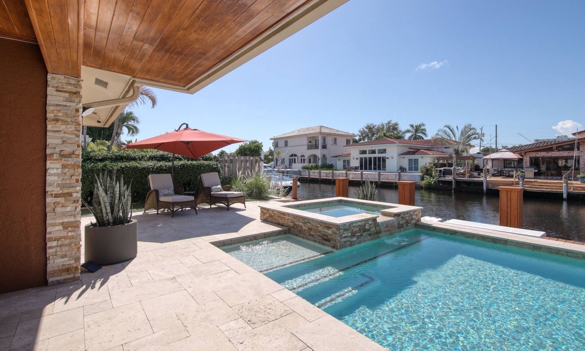 Pompano Isles House | Waterfront charmer with dock access, pool, hot tub, children's items, and W/D