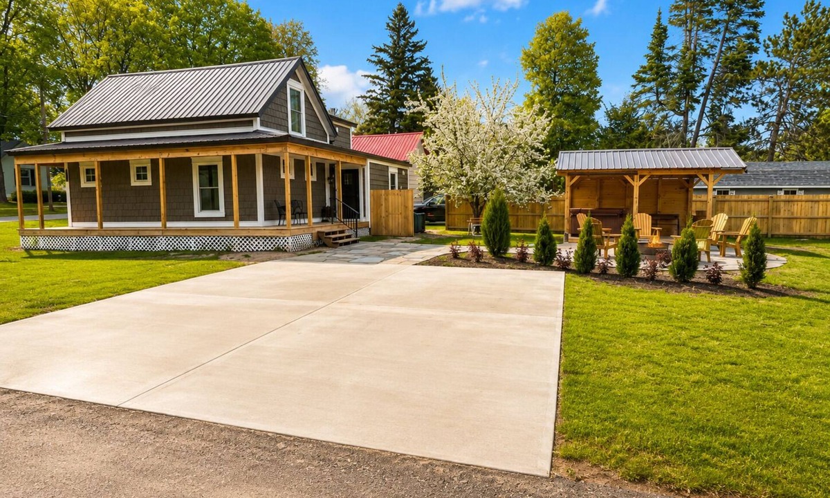 Arcadia House | Welcome to your Up North escape in downtown Arcadia. Newly remodeled with a hot tub and fire pit, just a short walk to Lake Michigan. Enjoy Arcadia Days, July 4th, Golf Crystal Mountain, and day trips to Sleeping Bear Sand Dunes.