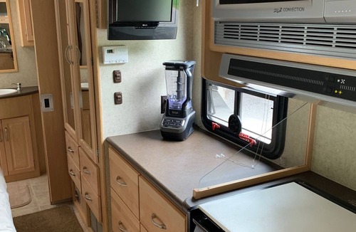Cedar House | 30' motorhome on private setting.