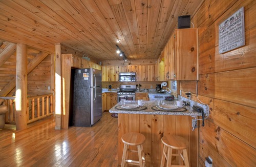 Foxfire Estates Cabin | Appalachian View charms with pet-friendly vibes, big mountain views, a hot tub, pool table, firepit, and WiFi connection