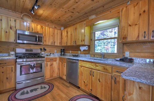 Foxfire Estates Cabin | Appalachian View charms with pet-friendly vibes, big mountain views, a hot tub, pool table, firepit, and WiFi connection