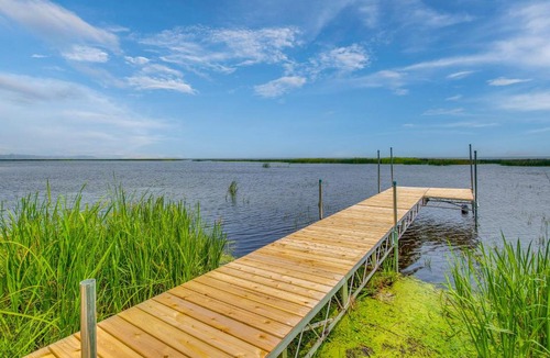 Oconto House | Bayfront Home! Dock, Deck, Hot Tub, & Fire Pit
