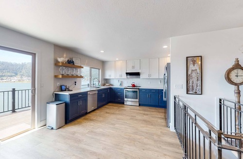Bay City House | Bayview home with a deck overlooking the locally famous Ghost Hole fishing spot