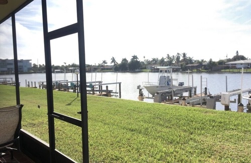 Cocoa Isles Condo | Beautiful sunsets from this ground floor Waterfront Condo - 3 month minimum