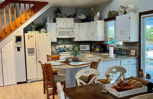 Port Pine Heights House | Big Pine House, 4/2 two story, canal access 75 ft dock and stunning Bay view.