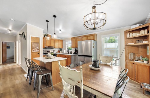 Mountain House | Brand new listing! Relax and unwind at this stunning Northwoods pool house featuring a private in-ground pool, fire pit, patio, garage space, and sleeping for 11 guests!