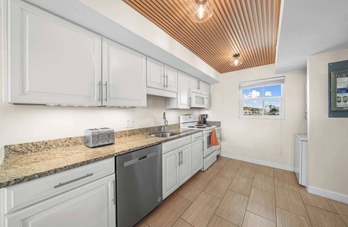 South Patrick Shores Condo | Bright Cozy Condo with Pool & Stunning Ocean Views