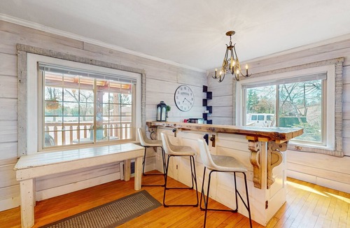 Arbor Vitae Cabin | Charming lakefront cabin with fireplace, cozy interior, streaming, & partial AC