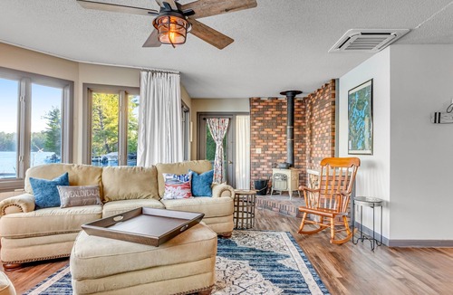 Three Lakes Cabin | Charming lakefront cabin with fireplace, on-site hot tub, firepit & games