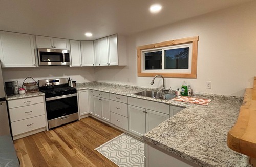 Boyne Falls Cabin | Charming Red Cabin in the woods. A perfect stay just 3 min from ski resort!
