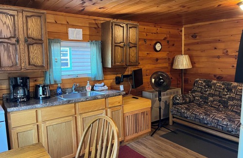 Lac La Belle Cabin | Charming Resort Cabin Steps from the Water and Campfire Evenings