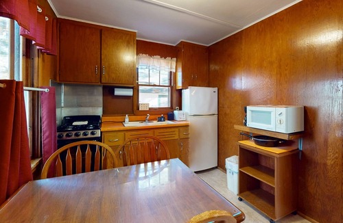 Manitowish Waters Cabin | Charming waterfront cottage with shared firepit, canoe, paddlebaot & docks