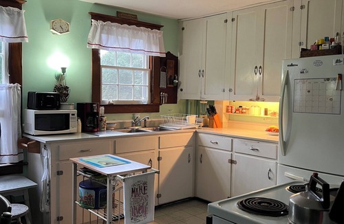 Pawcatuck House | Charming waterfront 1920s Craftsman-style home on 4+ private acres