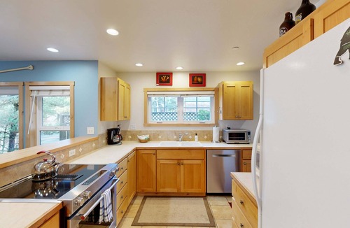 Shorepine Village House | Coastal home walking distance to the beach with outdoor shower and fireplace