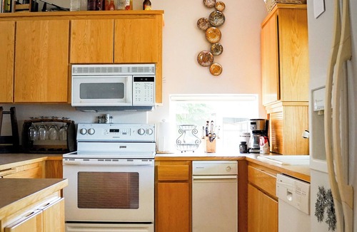 Olympia Apartment | Complete apartment with separate entrance, sunroom, paddle boards, kayaks, etc.