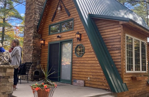 Paradise Cabin | Cozy Cabin nestled in the woods on all season road seconds from the trail system