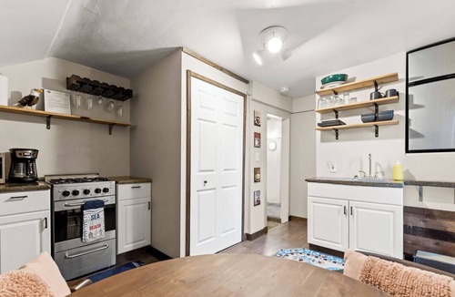 Grand Haven House | Cozy efficiency upper, a short walk downtown. Pet friendly with large backyard!
