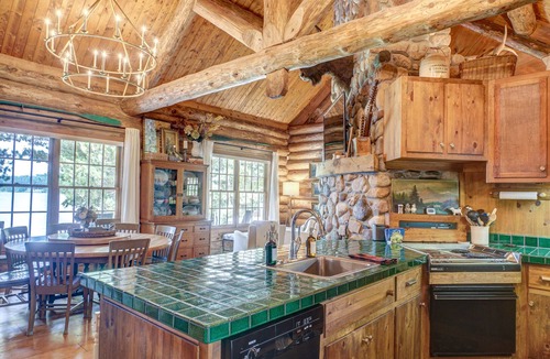 Spooner Cabin | Cozy Lake front luxury, hot tub, ice fish, snowmobile, fireplace, screened porch
