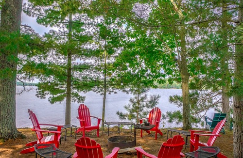 Spooner Cabin | Cozy Lake front luxury, hot tub, ice fish, snowmobile, fireplace, screened porch