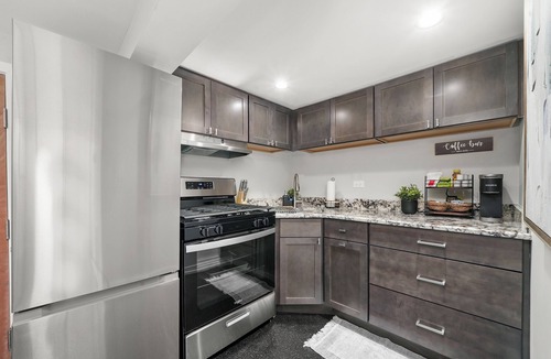 Irving Park Apartment | Cozy, Modern Garden Unit