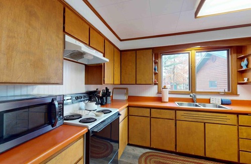 Manitowish Waters Cabin | Cozy riverfront cabin with dock, fire pit, and WiFi on the 10-Lake Chain