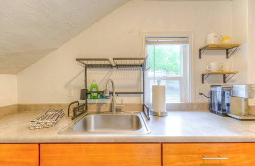 Greenwood Apartment | Creek-Front Crown Hill Craftsman with Hot Tub