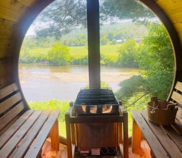 Johnson House | Designer A-Frame Treehouse with hot tub on river