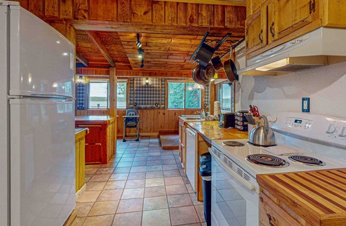 Presque Isle House | Dog-friendly lakefront home with boat access, deck, fireplace, gas grill, kayaks