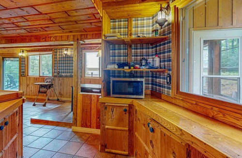 Presque Isle House | Dog-friendly lakefront home with boat access, deck, fireplace, gas grill, kayaks