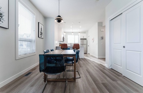 Evanston House | Enjoy a spacious and comfortable 3-bedroom corner townhome in Evanston Park, conveniently located near parks, walking trails, shops, major routes, and Calgary attractions.