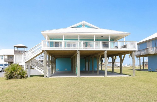 Grand Isle House | Experience beachfront luxury at Orange Beach Retreat in Grand Isle, LA, perfect for 16 guests.
