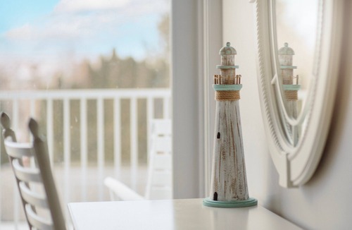 Bay Harbor Condo | Experience luxury at Captain Suite 219 in Bay Harbor, MI, featuring a cozy bedroom and village view.