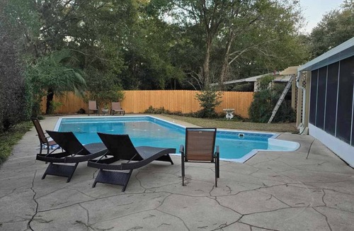 Northeast Pensacola House | Family Vacation Home, Large Saltwater Pool, Tropical Courtyard, Enclosed Patio