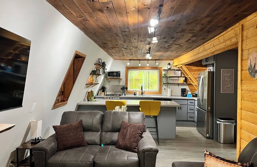 Ashford Cabin | Flowing creek, relaxing hot tub and a firepit to enjoy when the sun goes down!